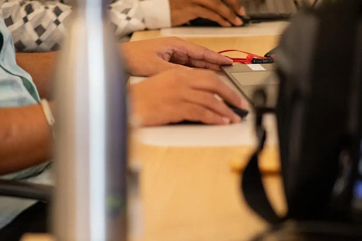 Hands typing on a keyboard