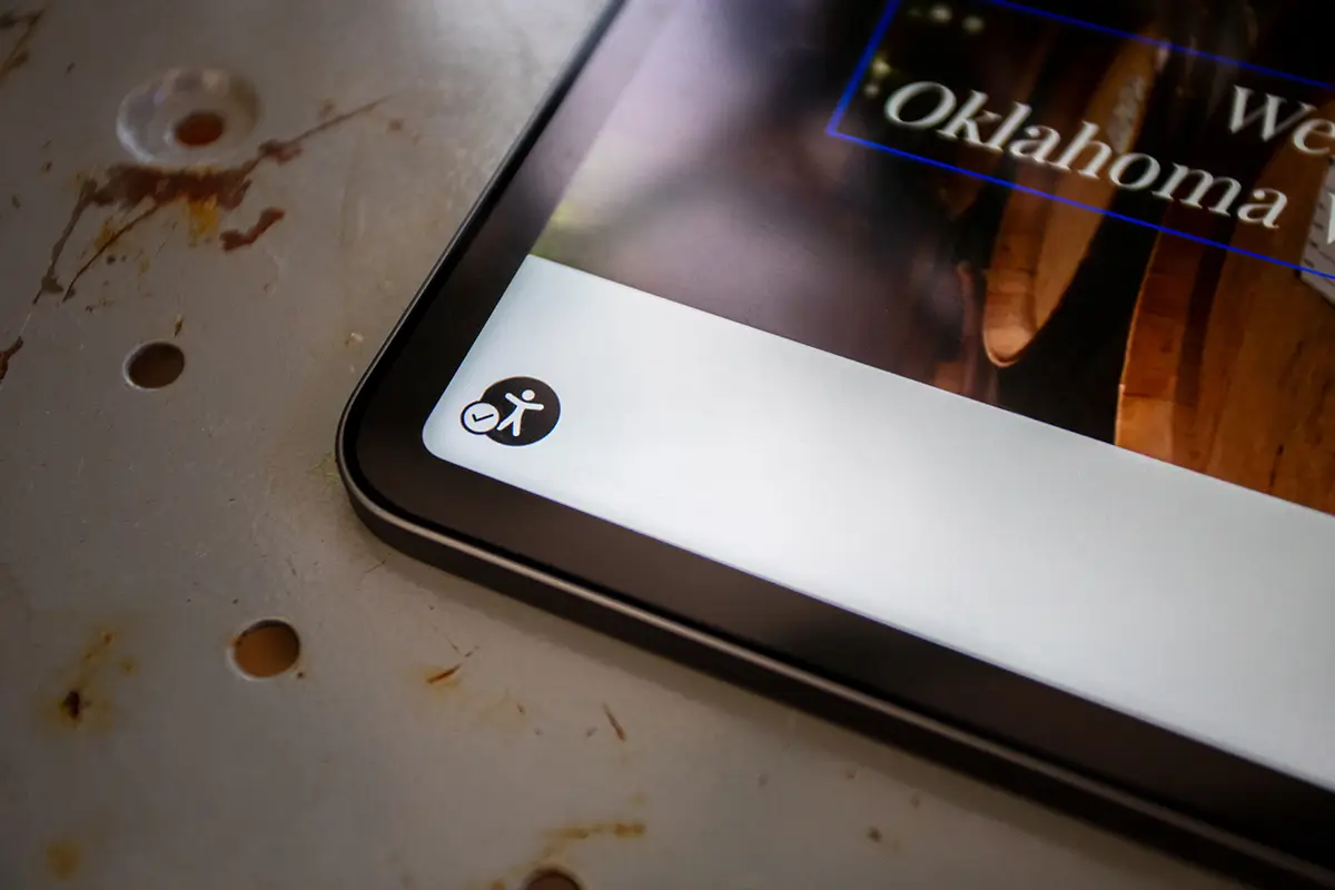 An angled, close-up shot of an iPad screen displaying a white toolbar.